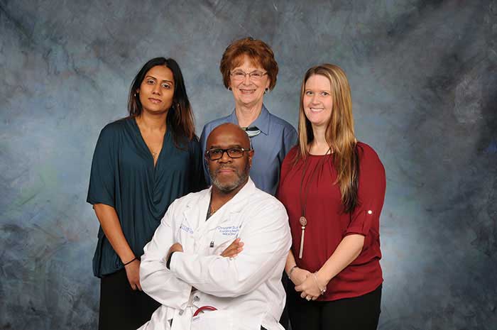 Dr. Christopher Scott, M.D., Chief of Staff and Divisional Chair of Emergency Medical Services and three team members.