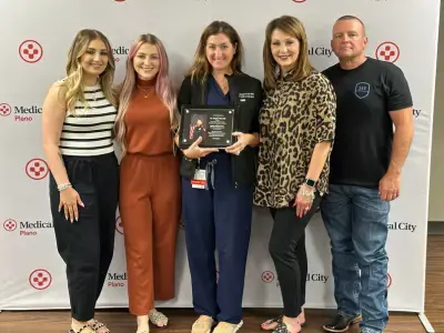 Dr. Post with Aubrey Dawson and family at a ceremony.
