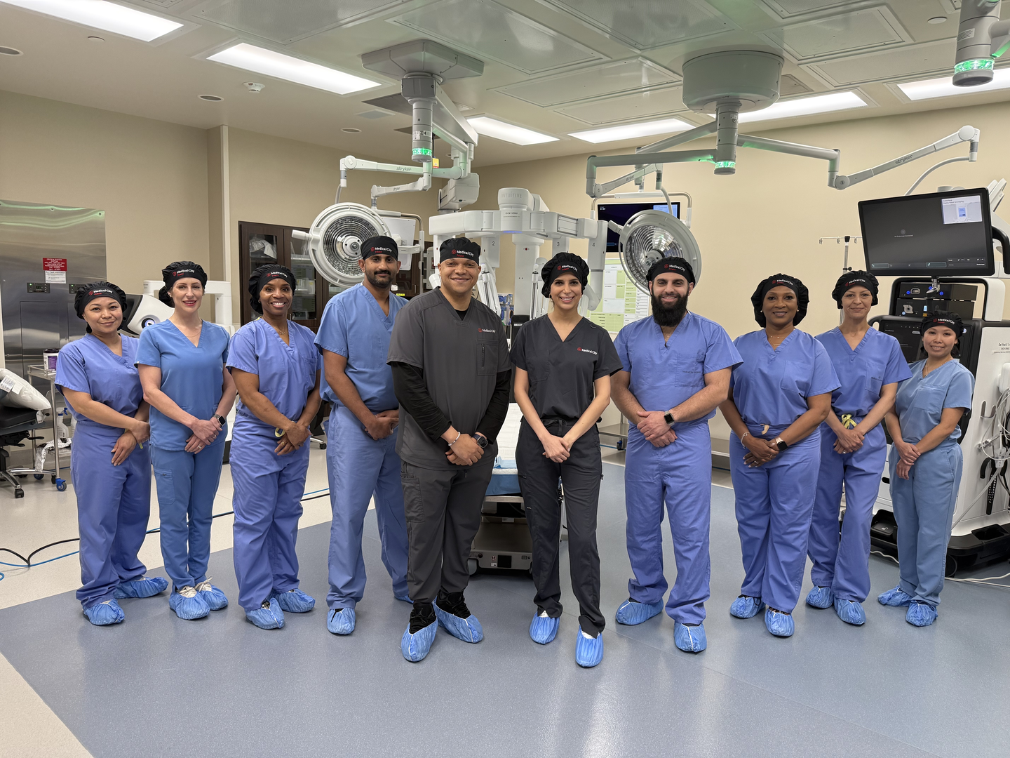 Medical City Frisco staff photo in front of surgical robot
