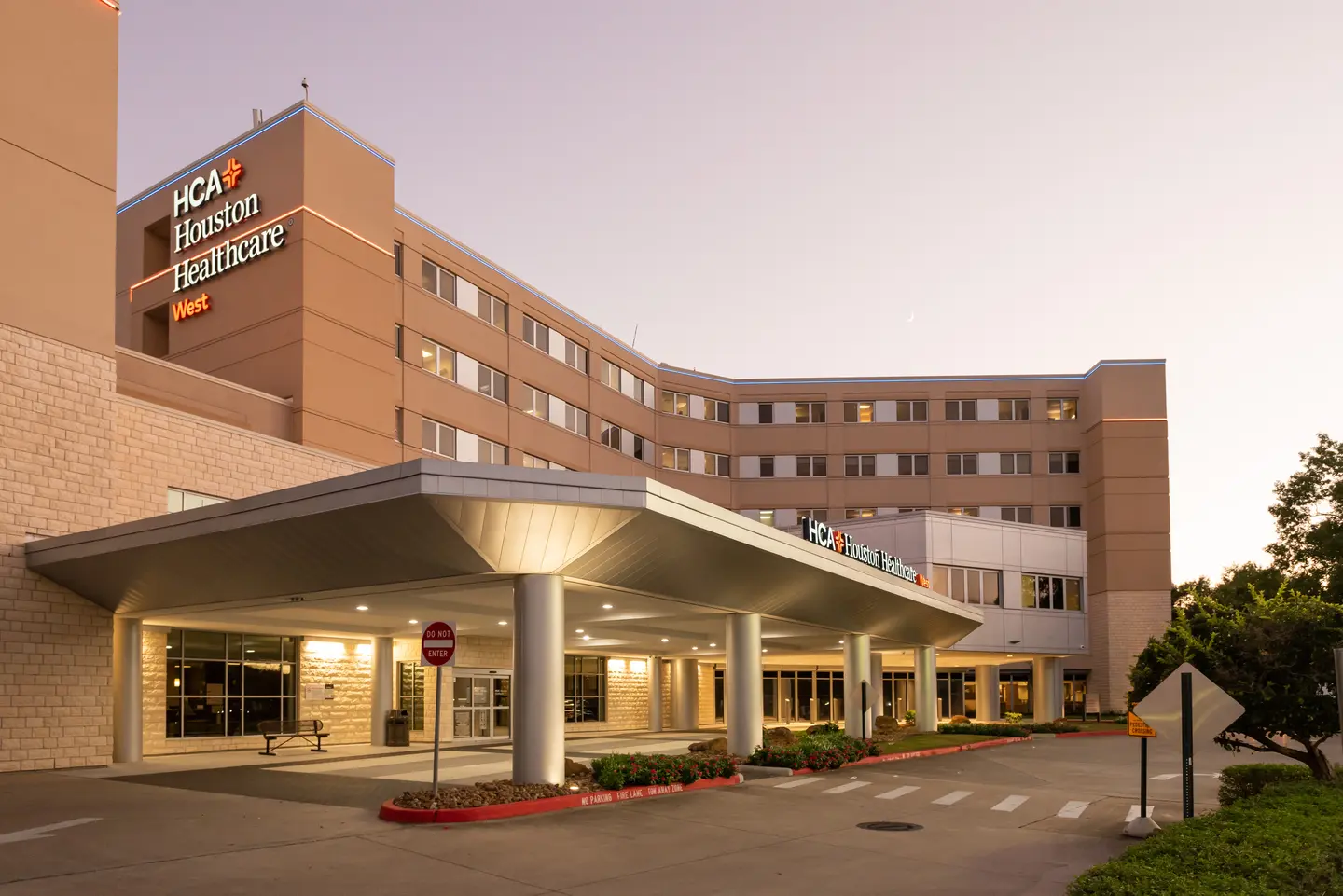 HCA Houston Healthcare West Hospital exterior entrance evening photo