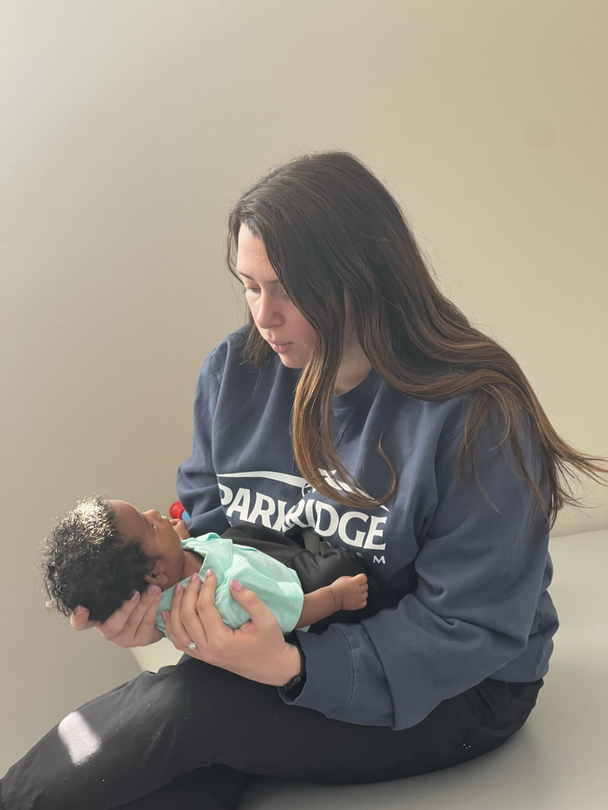 Physical therapist Lexy Chapin holds baby Jamariyon