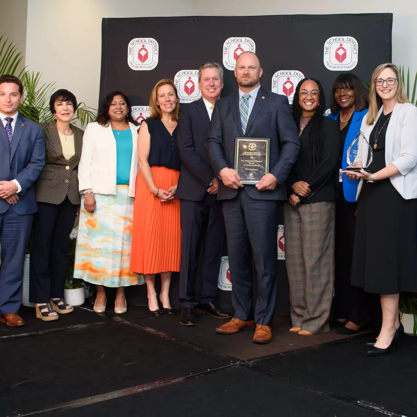 [Pictured L to R] Anthony Terranova Executive Resident JFK Hospital, School Board chair Karen Brill, Narupa Baldeosingh communications director JFK North, Kathryn Walton communications director JFK Hospital, Superintendent Mike Burke, Jason Kimbrell CEO Palms West Hospital,  Celina Holson COO JFK North Hospital, School Board member and Palms West Hospital Board member Marica Andrews, Assistant-Vice President of Community Engagement HCA Healthcare East Florida Division, and Julie Houston Trieste communications director Palms West Hospital.