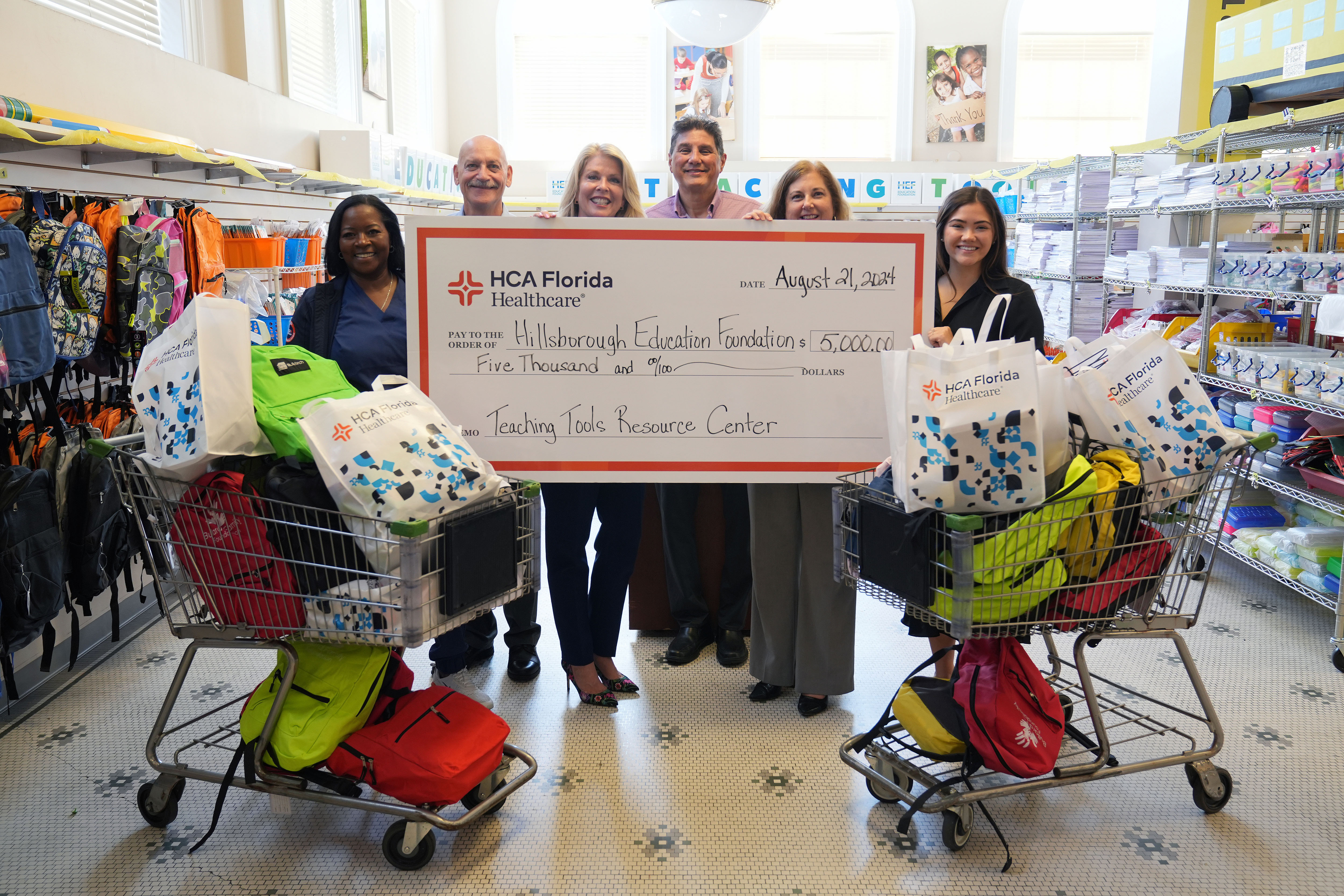 HCA Florida South Tampa Hospital delivers donated supplies to the Hillsborough Education Foundation along with a $5,000 check from HCA Florida Healthcare for the Hillsborough County Education Foundation's Teaching Tools Resource Center
