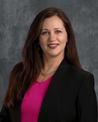 A smiling, professional headshot of Sonia Baughman, CFO of Mountainview Hospital.