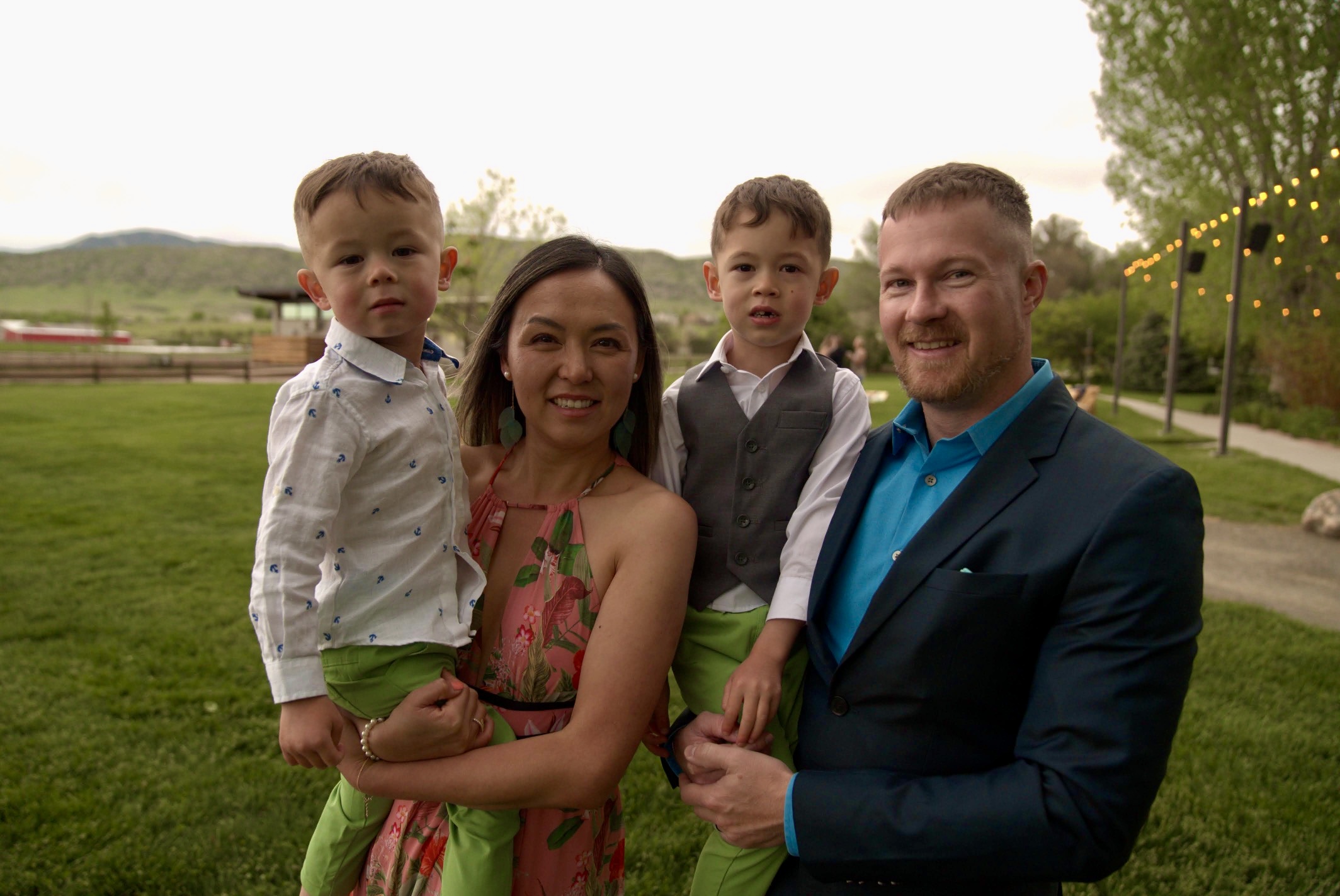 Lili poses with two children and her husband