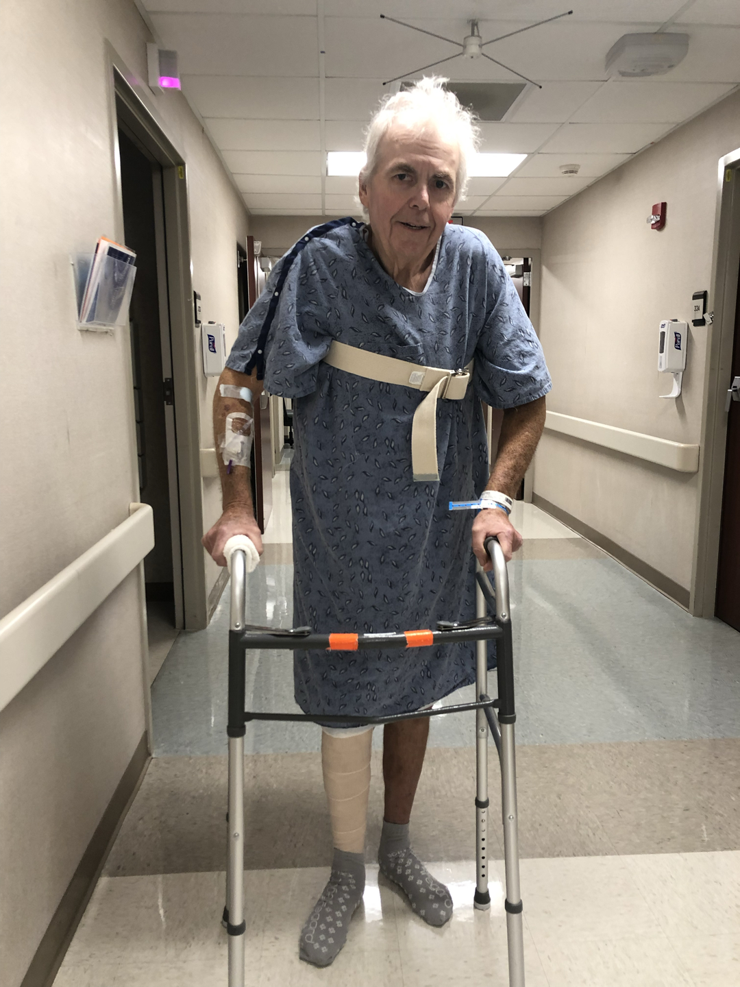 David Johnson walking with the assistance of a walker.