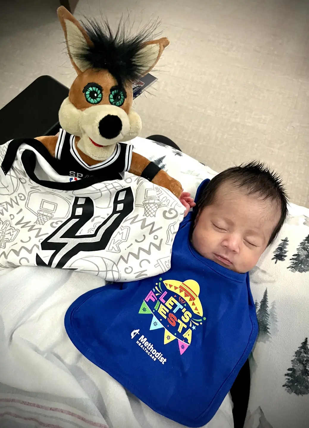 Baby celebrate their first Fiesta in custom bibs.