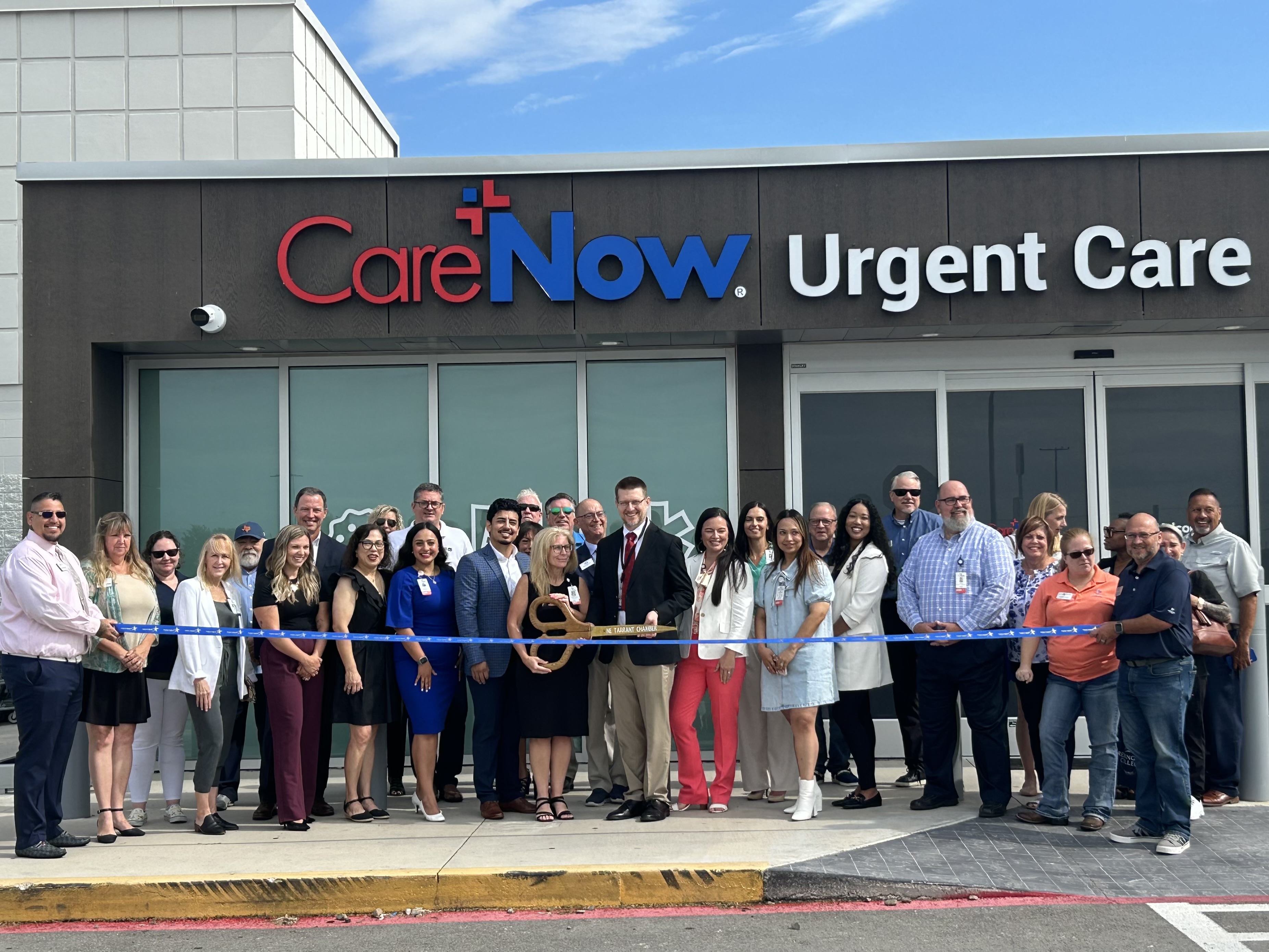 Ribbon cutting outside the facility.