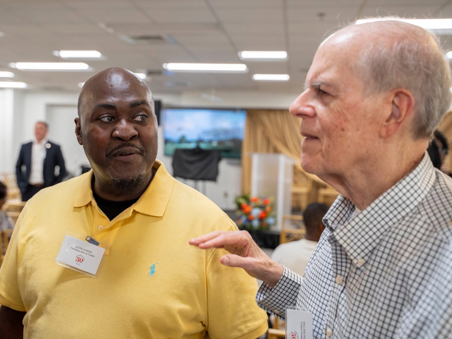 (l-r) Jason Cordes, was the first baby born at Trident Medical Center, with William Wimberly, MD, who performed the first procedure after the hospital opened July 21, 1975.