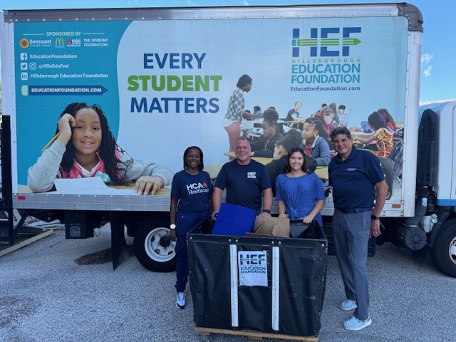 HEF Truck with colleagues and donated supplies