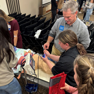 Local high school students engage with medical professionals at the Health Career Expo hosted by Portsmouth Regional Hospital.