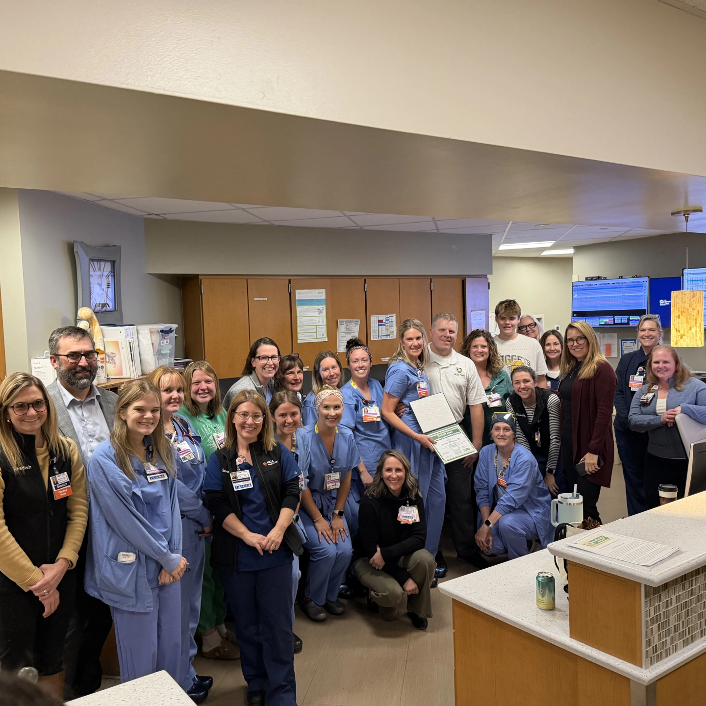 group photo of the award winner and team