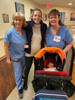 Dr. Carmen Vandal and Declan with nurses