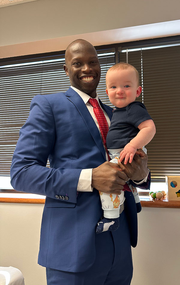 Dr. Patrick Christopher smiles while holding Parker during his time at Overland Park Regional Medical Center.