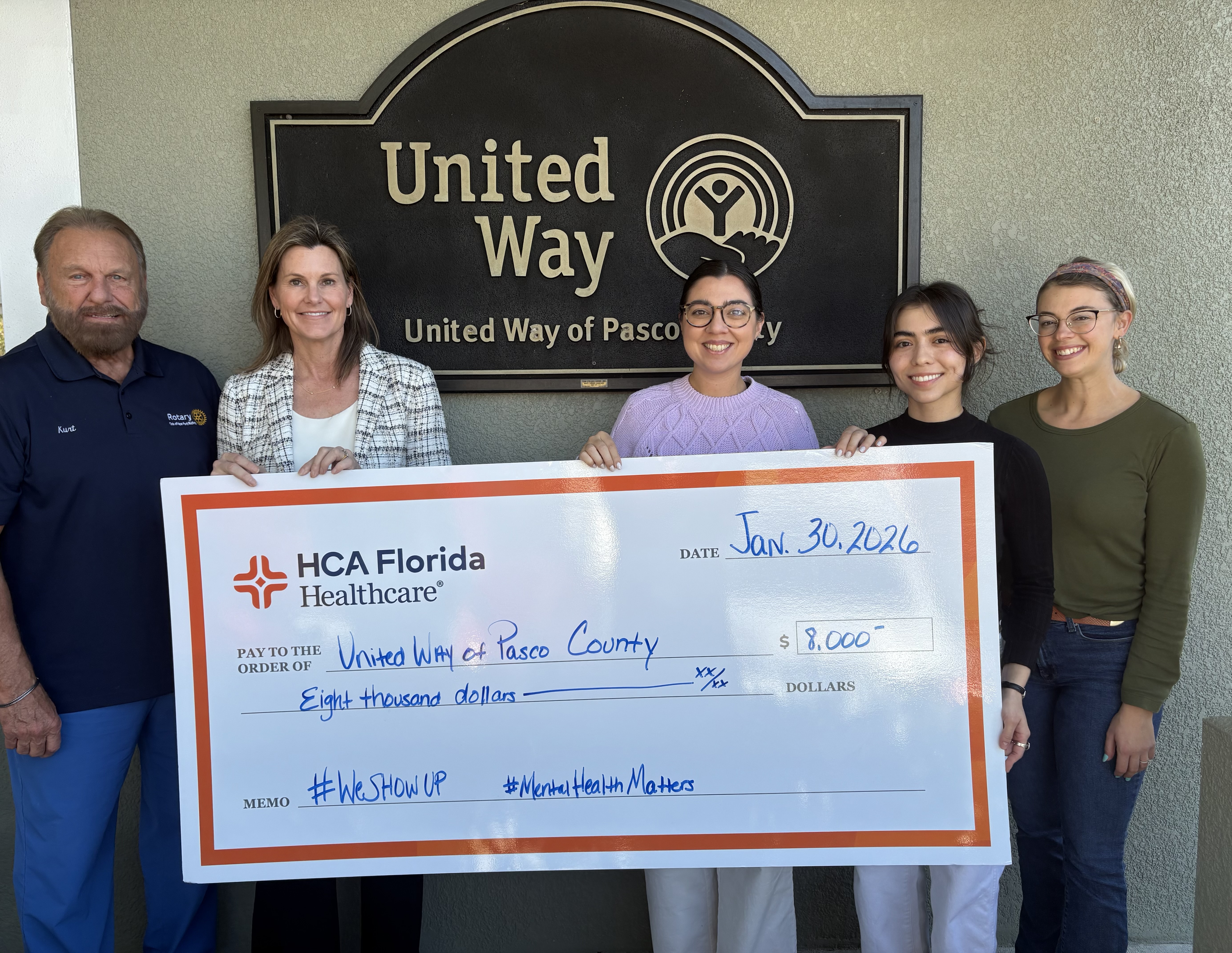 HCA Florida Bayonet Point Hospital presents $8,000 check to United Way of Pasco County.