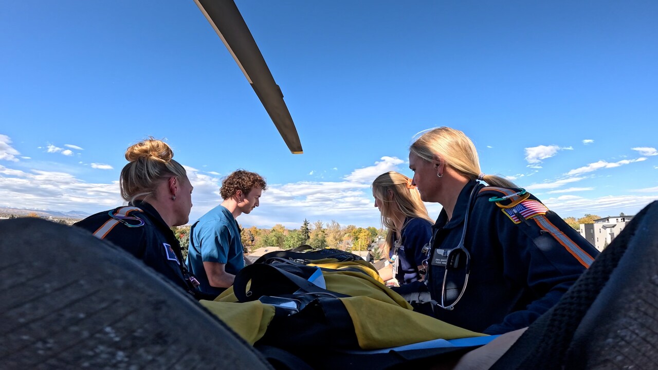 HCA HealthONE Cares Swedish Air Life team with a patient on a gurney.