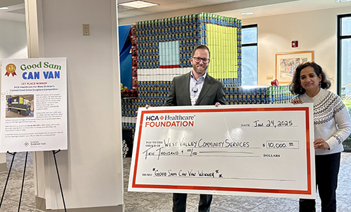 Patrick Rohan, CEO of Good Samaritan Hospital, presenting a check for $10,000 to Sujatha Venkatraman, Executive Director of West Valley Community Services, to directly support the organization’s Park-It Market.