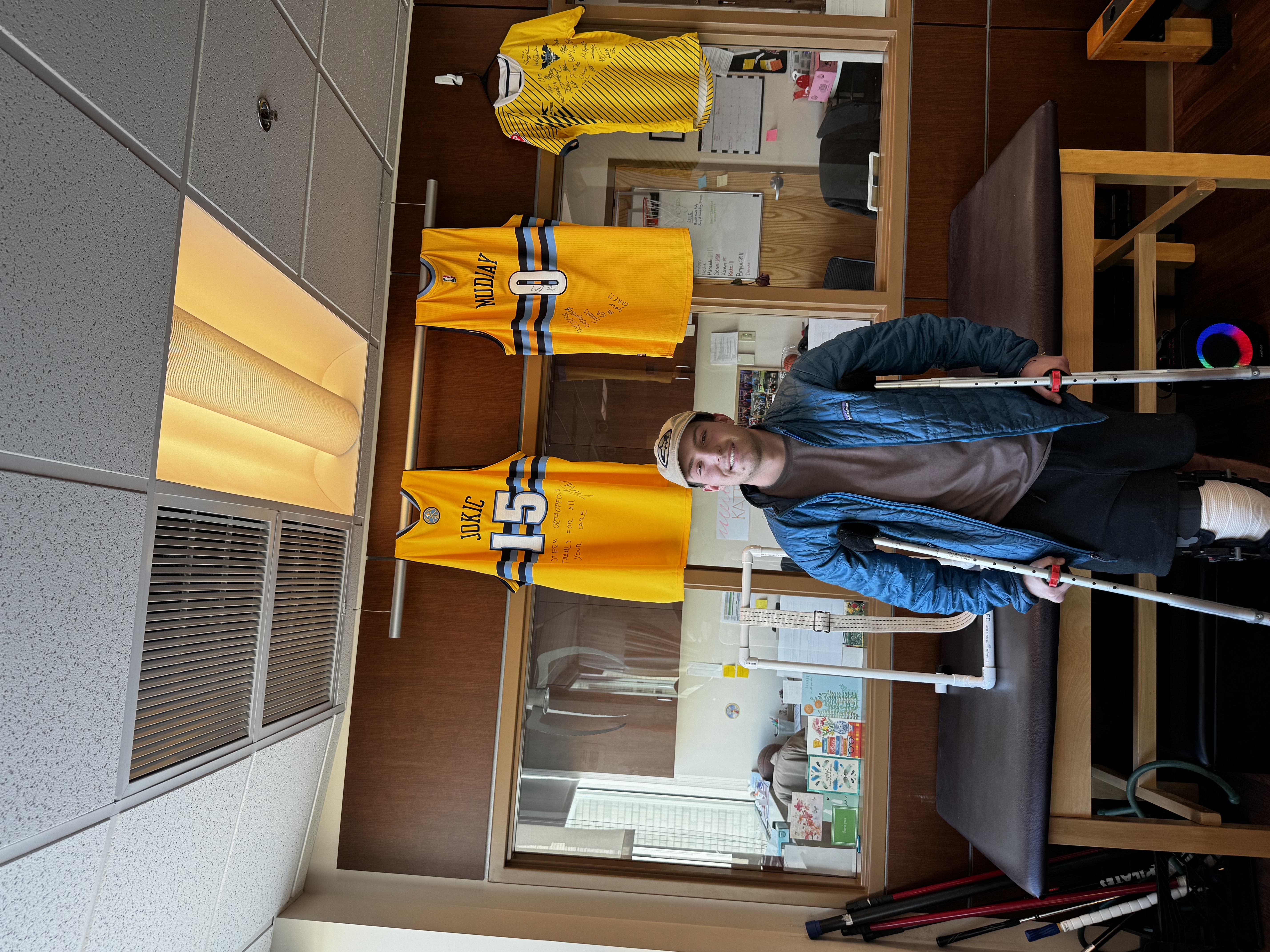 Zach on crutches at rehab.