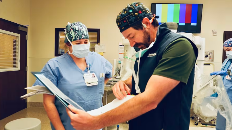 Doctor and nurse lookover clipboard.