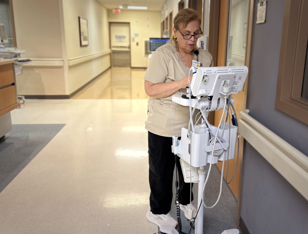 Lisa Rodriguez at work in the hallways at Methodist Hospital Texsan