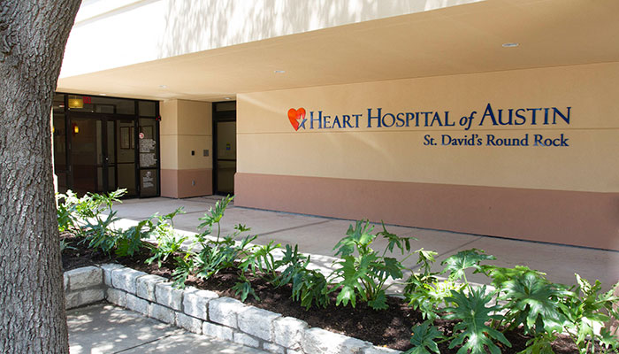 Exterior of the Heart Hospital of Austin at St. David's Round Rock Medical Center on a sunny day.