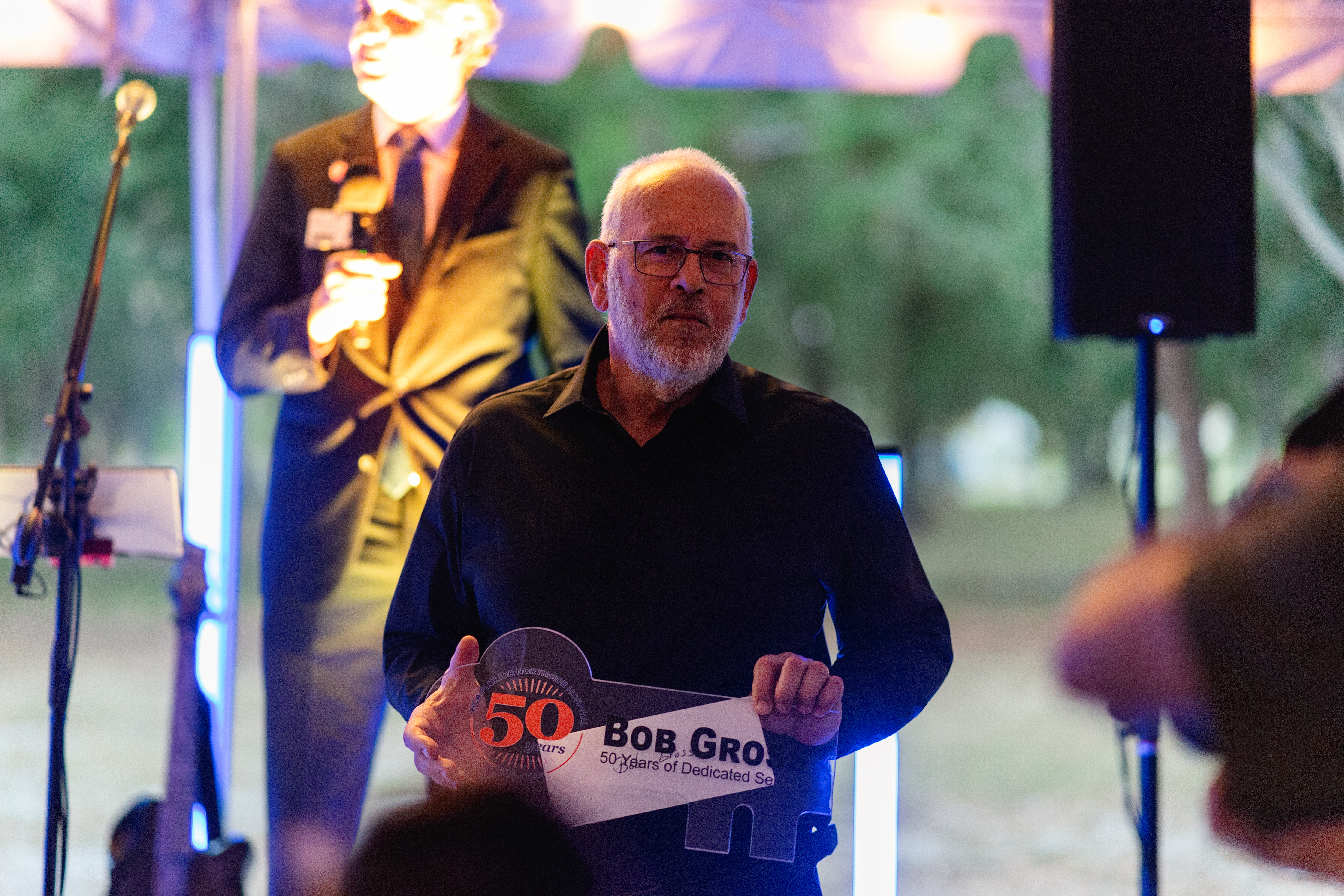 Bob Gross speaking at event.