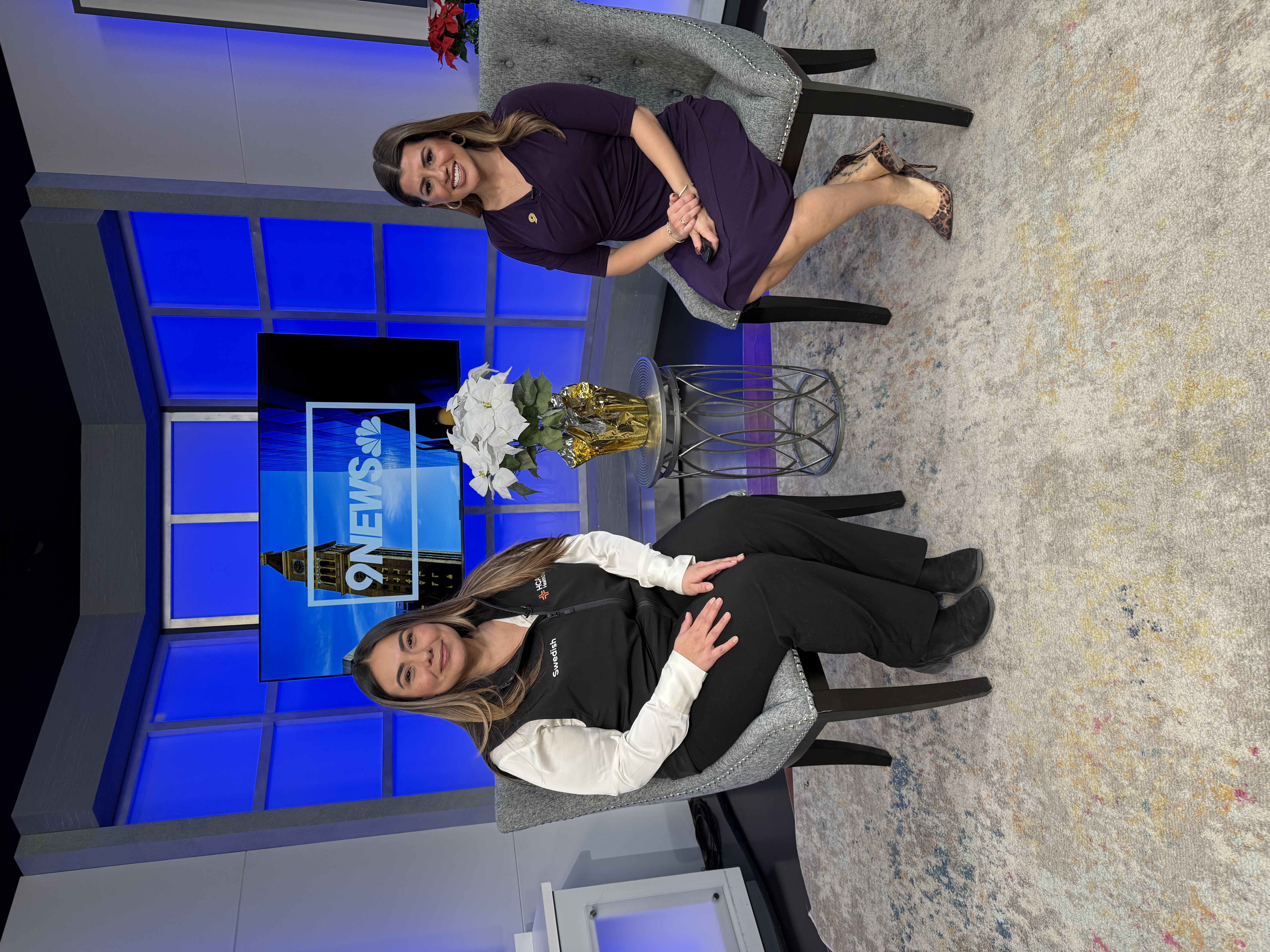 Two women are on a TV set.