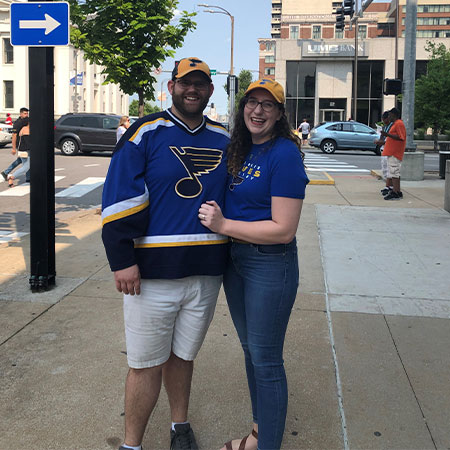Derrick and Lauren Naegler standing on the street.