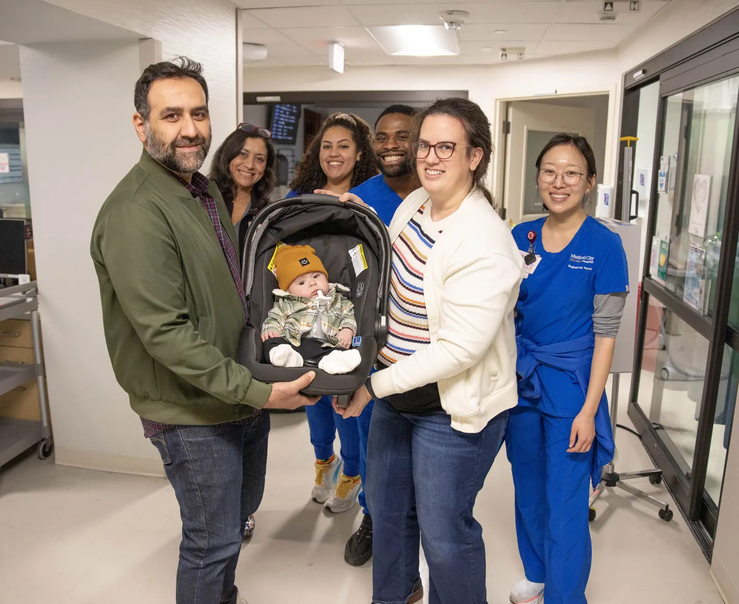 Martha Penturf, her baby boy, Atlas and their care team.