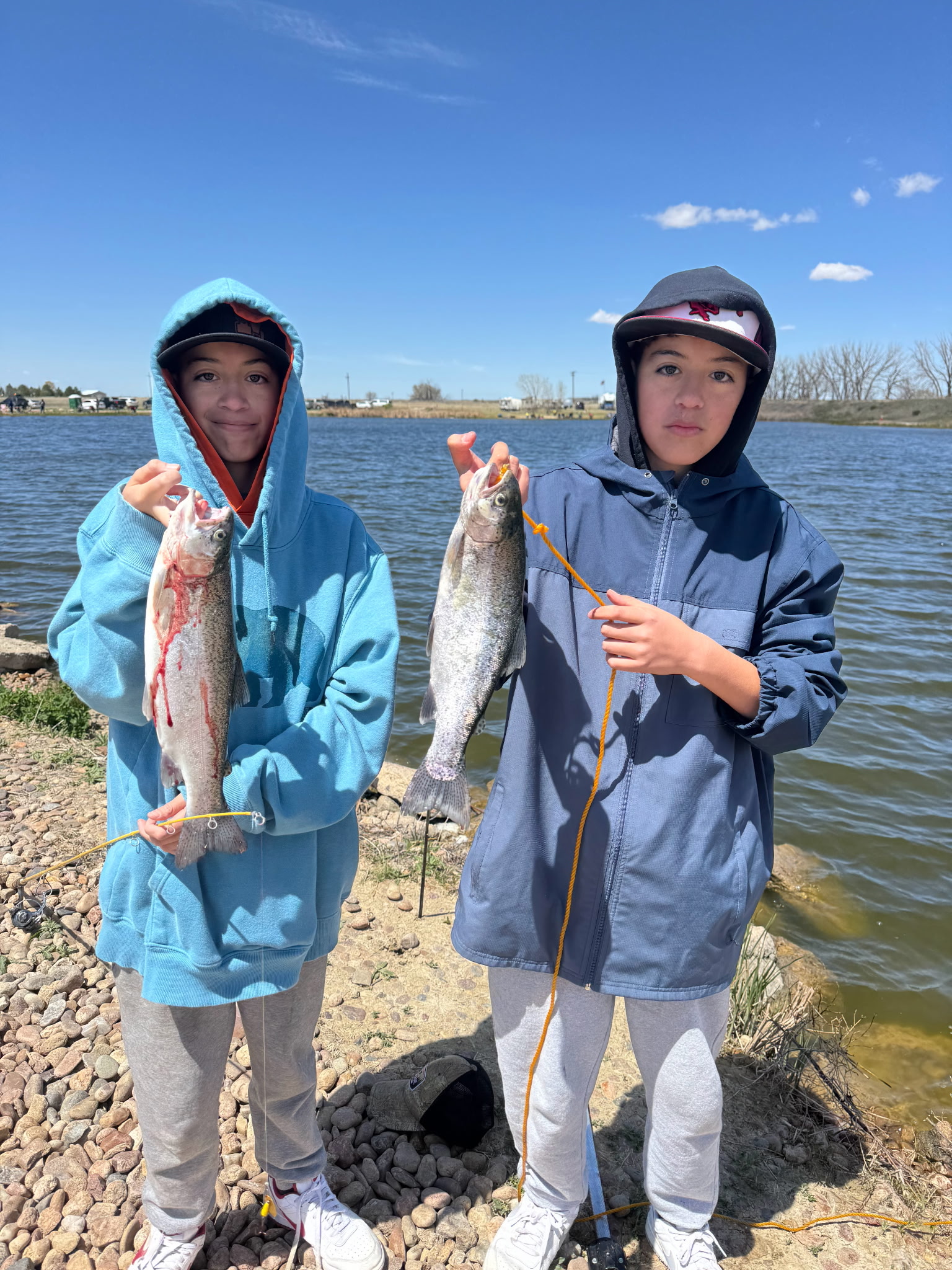 Jordan Palomar and other posing with fish they just caught.