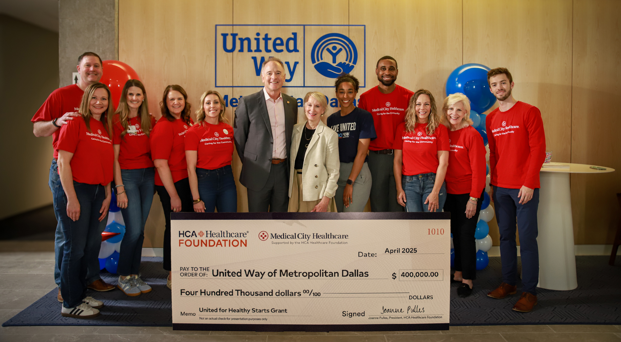 Group photo with check for $400,000.