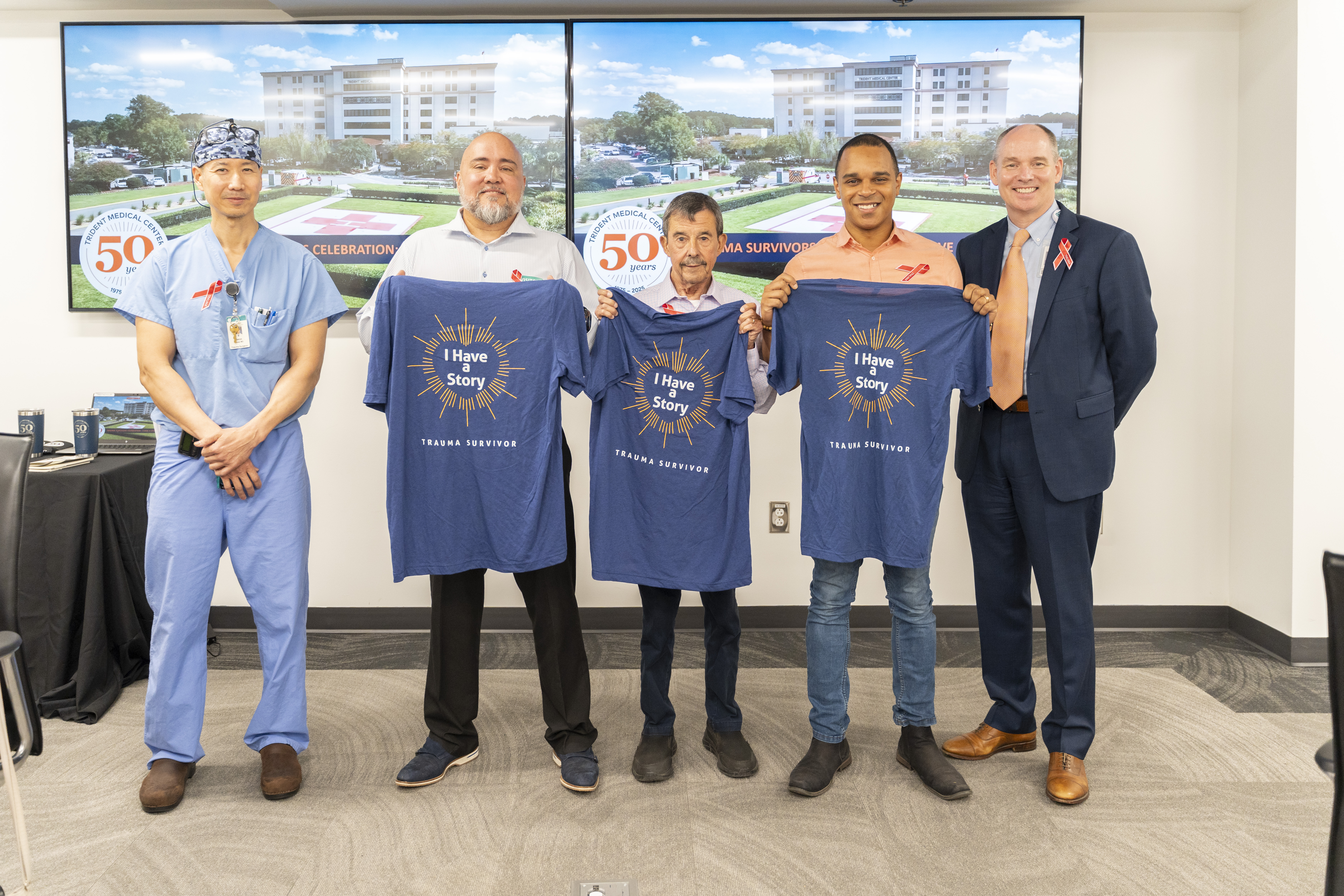 Trident Medical Center trauma surgeon Seon Jones, MD joins survivors Ed Bazzell, Luke Pickering and Eric Baldoni and Jeff Wilson, President, Trident Health and CEO, Trident Medical Center at the hospital's 2025 Trauma Survivors Celebration.