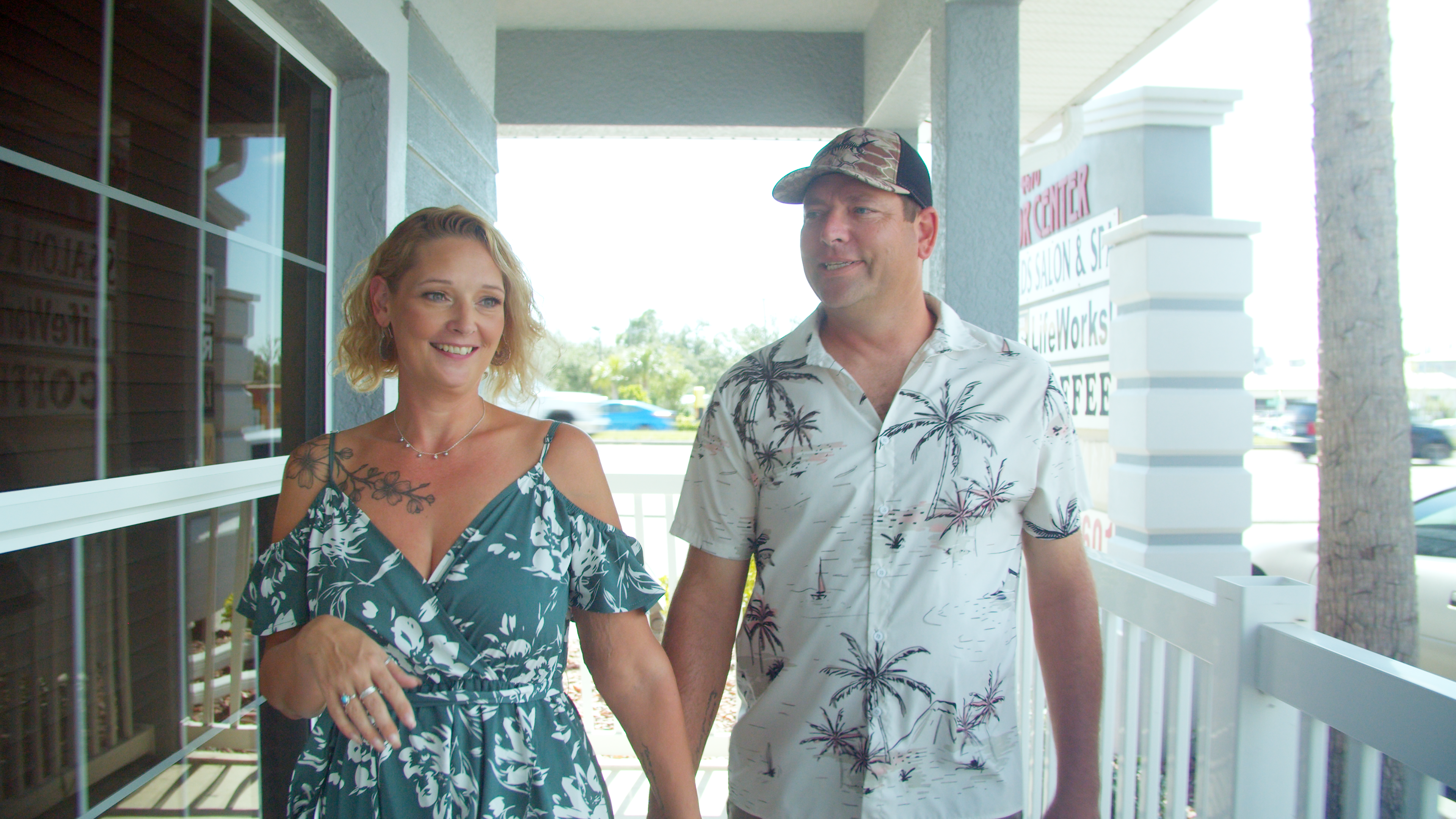 Michelle Davis and Husband walk hand in hand.